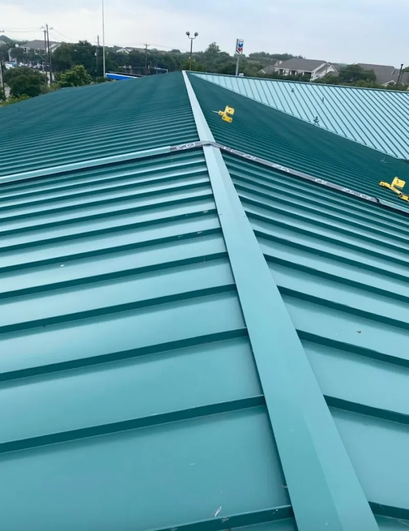 Green commercial metal roof ridge and valley for Metal Roof Repair in Clover Creek